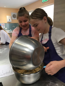 Two girls cooking together